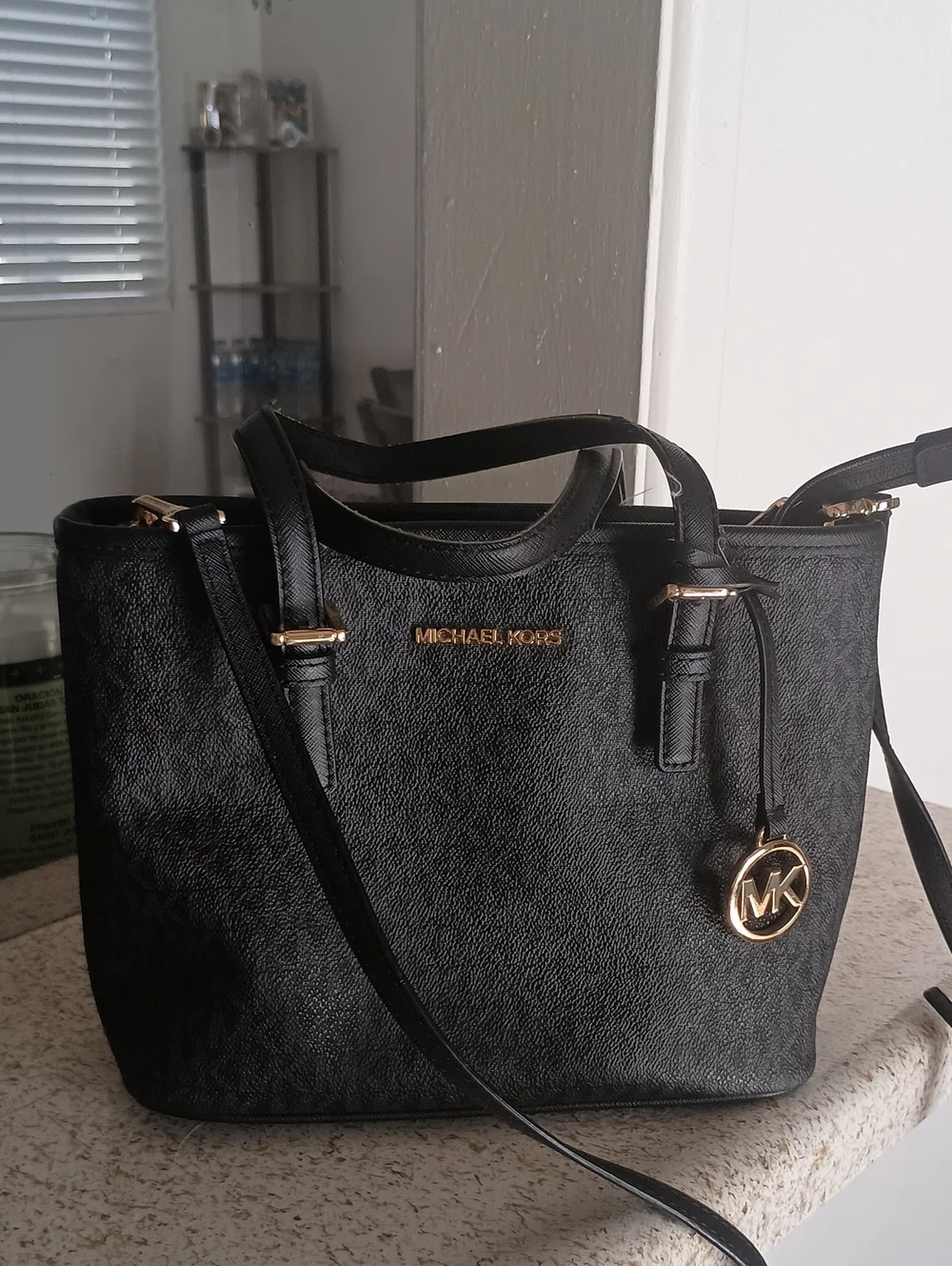 jet set travel extra-small logo top-zip tote bag black Michael Kors Make an impression wherever you go with this iconic bag that effortlessly blends style and practicality. Michael Kors Outlet Jet Set